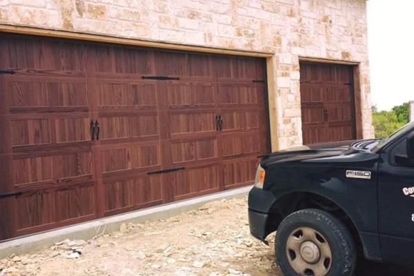2 faux wood garage doors